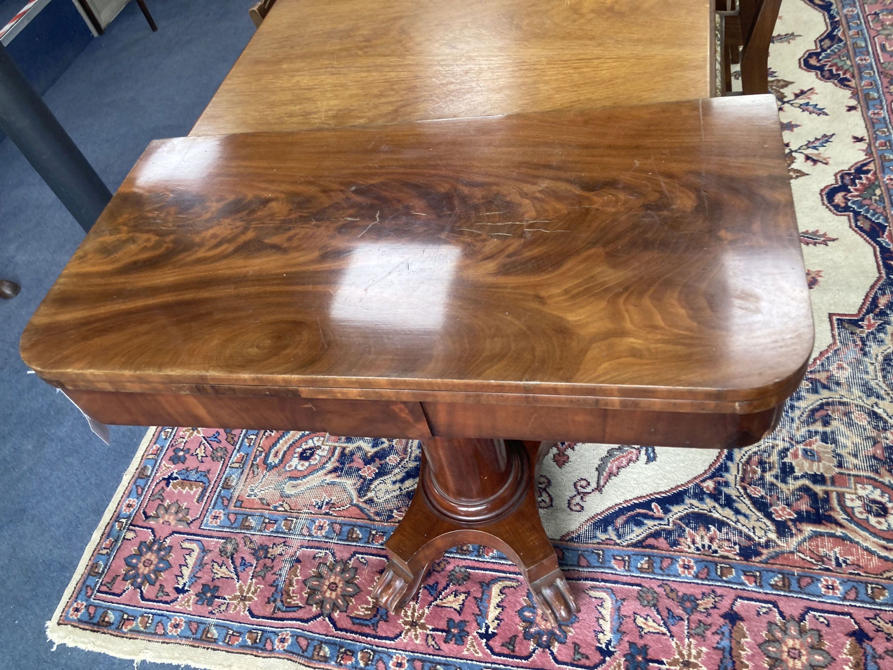 A Victorian mahogany folding card table in flamed veneers, 91cm diameter (91 x 45cm closed), 76cm high